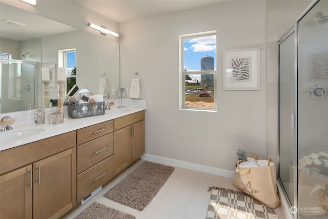 bathroom featuring vanity and an enclosed shower