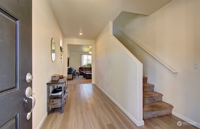 corridor with light hardwood / wood-style flooring