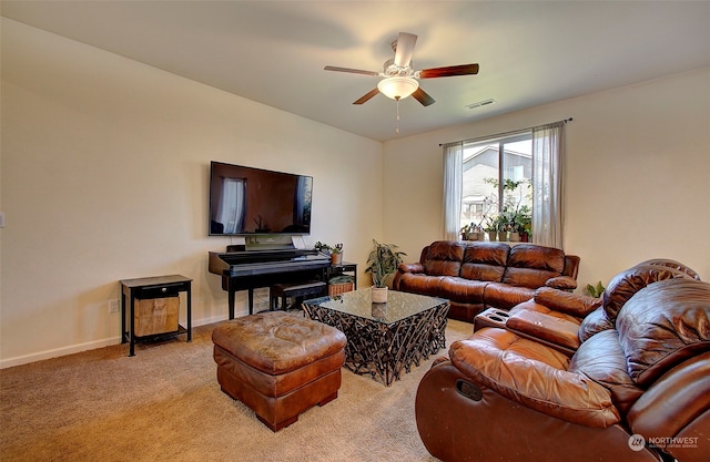 living room with ceiling fan and light carpet