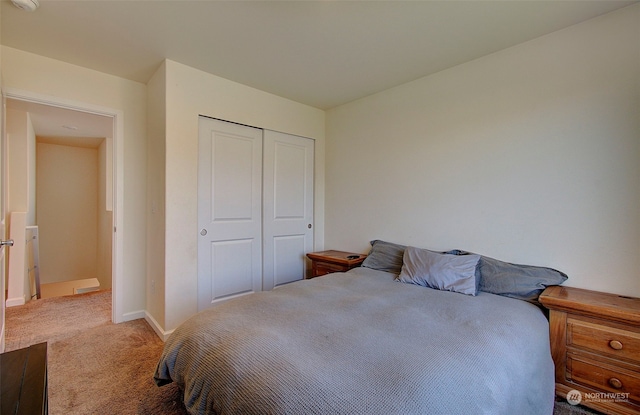 bedroom featuring a closet and carpet