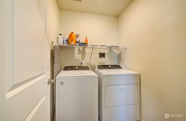 laundry area featuring separate washer and dryer