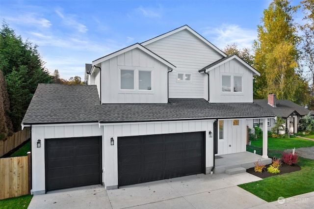 view of front of house with a garage and a front lawn