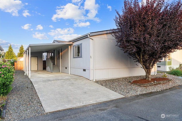 manufactured / mobile home featuring a carport