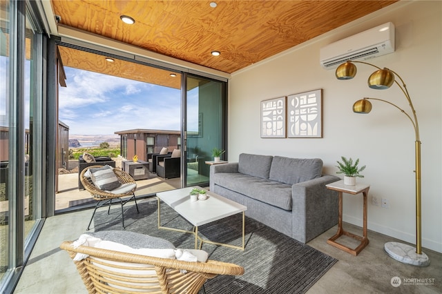 living room with a wall mounted AC, a wall of windows, concrete floors, and wooden ceiling