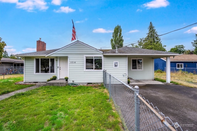 ranch-style home with a front lawn