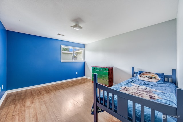 bedroom featuring wood-type flooring