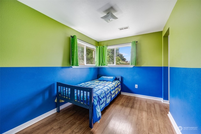 bedroom featuring hardwood / wood-style flooring