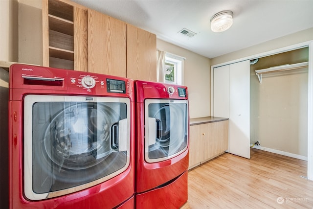 washroom featuring light wood-type flooring and washer and dryer