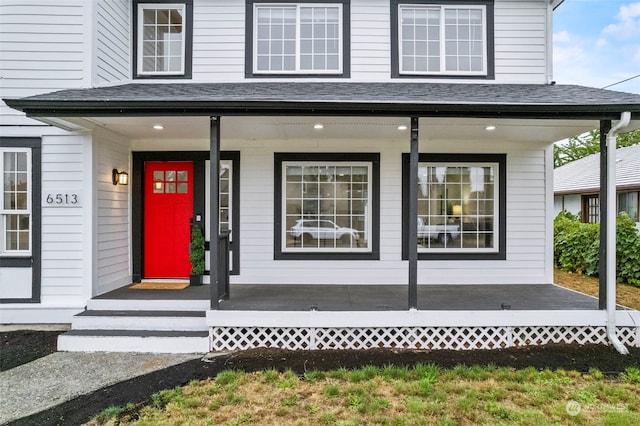 view of exterior entry with covered porch