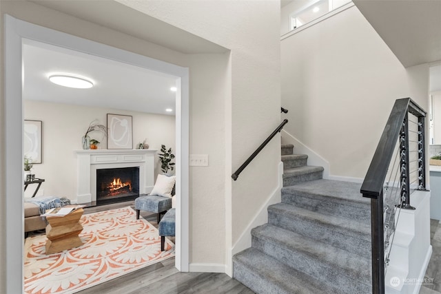 stairs with wood-type flooring