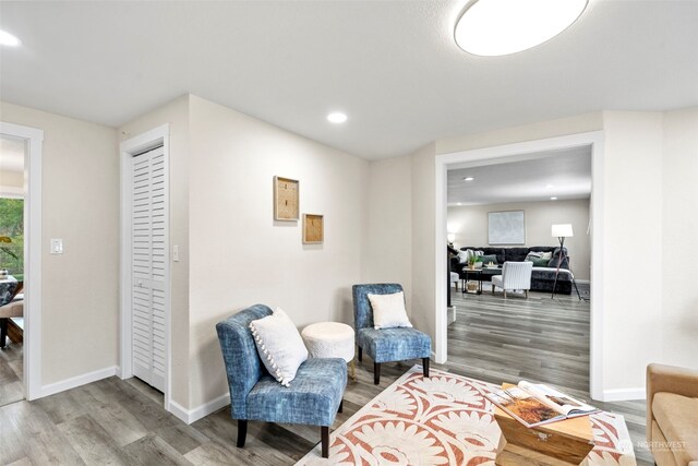 living area with hardwood / wood-style flooring