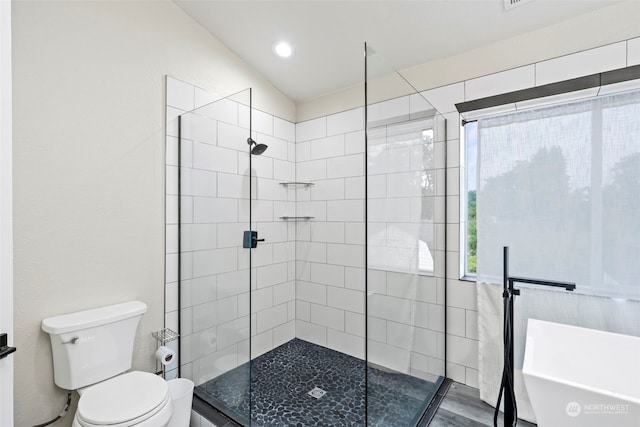 bathroom with independent shower and bath and toilet