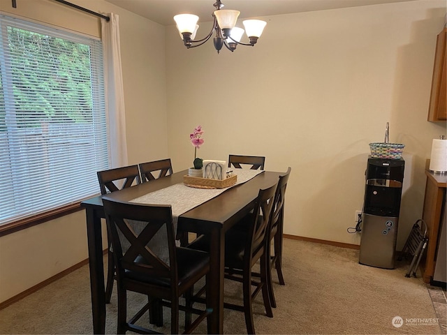 11714 9th Avenue Ct E, Tacoma, WA 98445 - dining area featuring light carpet, baseboards, and an inviting chandelier