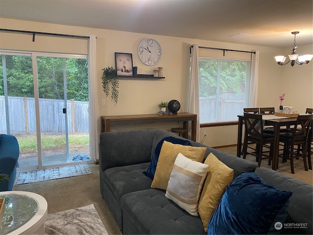 11714 9th Avenue Ct E, Tacoma, WA 98445 - carpeted living room with a chandelier