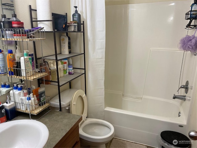 11714 9th Avenue Ct E, Tacoma, WA 98445 - full bathroom with toilet, shower / tub combo, a textured wall, and a sink