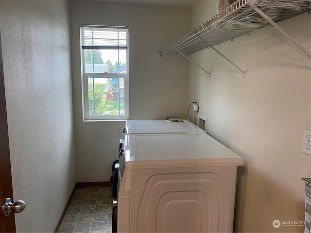 11714 9th Avenue Ct E, Tacoma, WA 98445 - laundry area with baseboards, washing machine and dryer, and laundry area