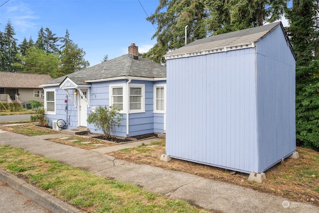 exterior space featuring a storage shed