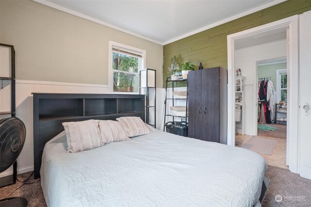 bedroom with carpet floors and ornamental molding