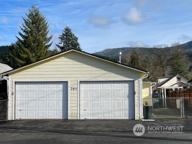 205 Monroe St, Ryderwood, WA 98581 - detached garage featuring fence and a mountain view