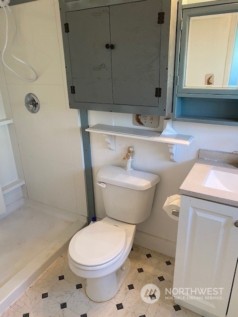 205 Monroe St, Ryderwood, WA 98581 - full bathroom featuring a shower stall, toilet, and vanity