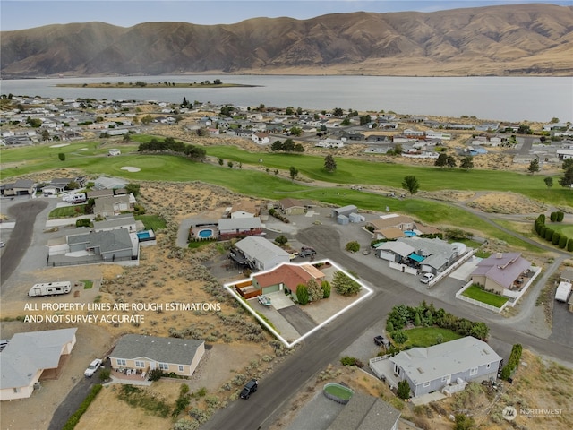 bird's eye view with a water and mountain view