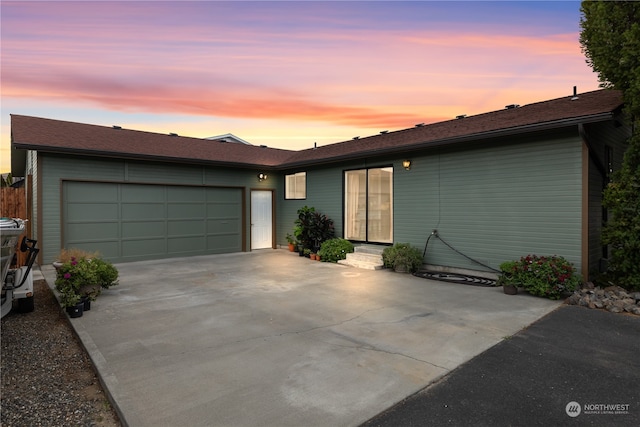 ranch-style home featuring a garage