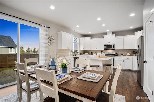 dining space featuring dark hardwood / wood-style flooring