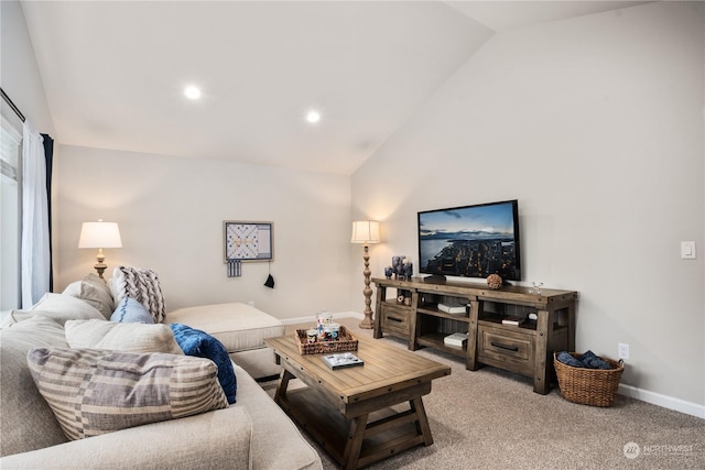 carpeted living room featuring lofted ceiling