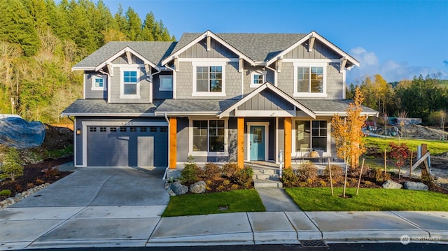 craftsman house with a garage and a porch