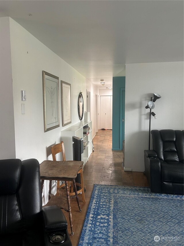 living room with dark tile patterned floors