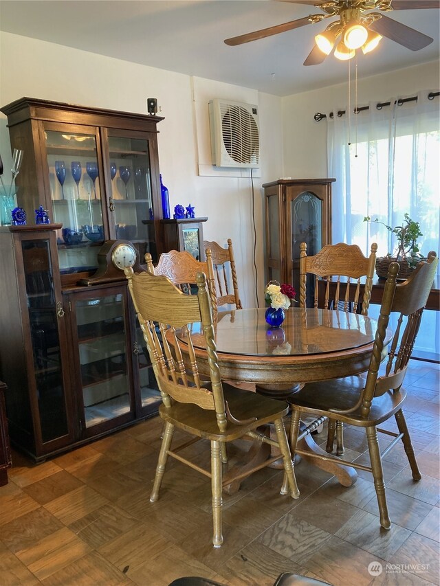 tiled dining area featuring ceiling fan