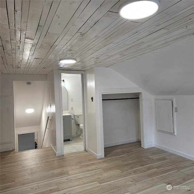 additional living space with vaulted ceiling, wooden ceiling, and light hardwood / wood-style floors