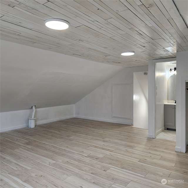 bonus room featuring light wood-type flooring, wood ceiling, and lofted ceiling