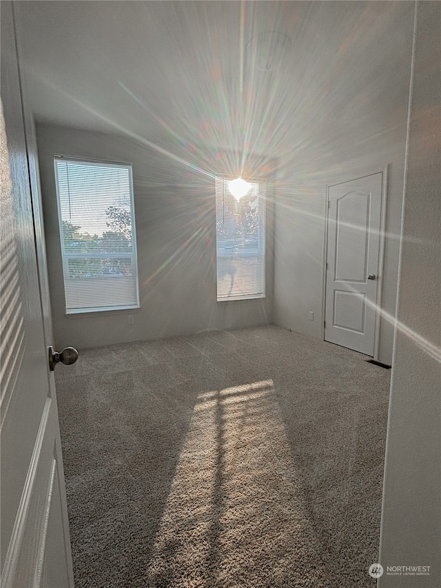 empty room with carpet flooring