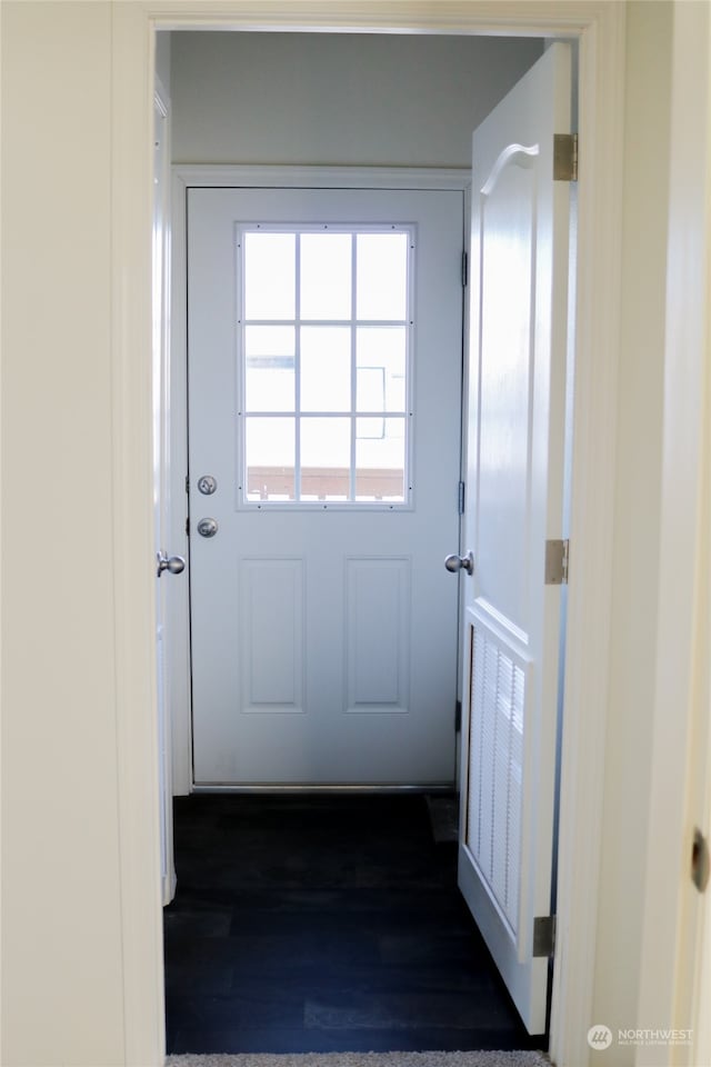 entryway with dark hardwood / wood-style floors