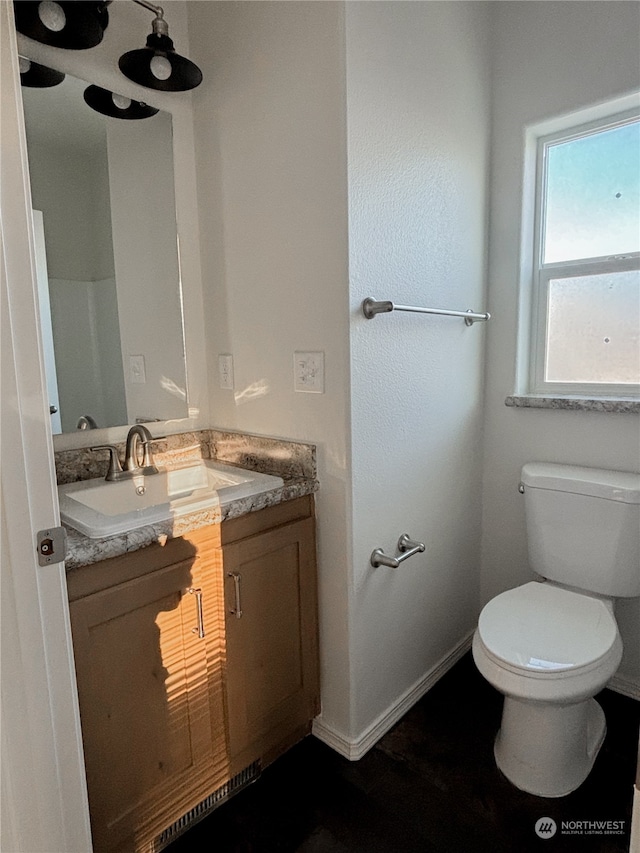 bathroom with vanity and toilet