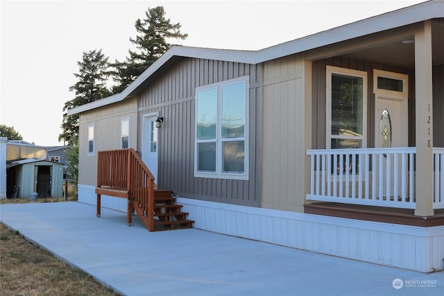 view of front of house featuring a storage shed