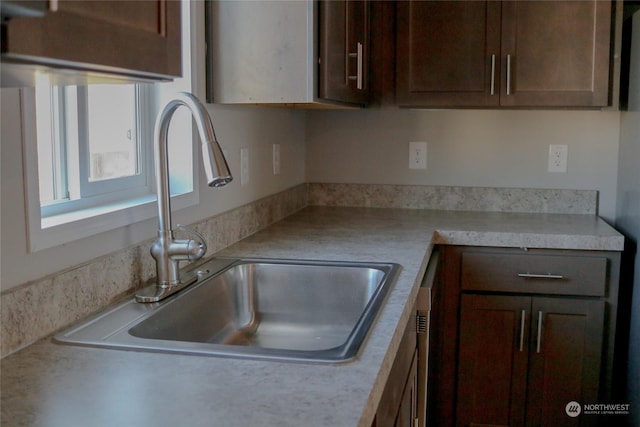 1223 Jones Dr, Walla Walla, WA 99362 - kitchen featuring light countertops, a sink, and dark brown cabinetry