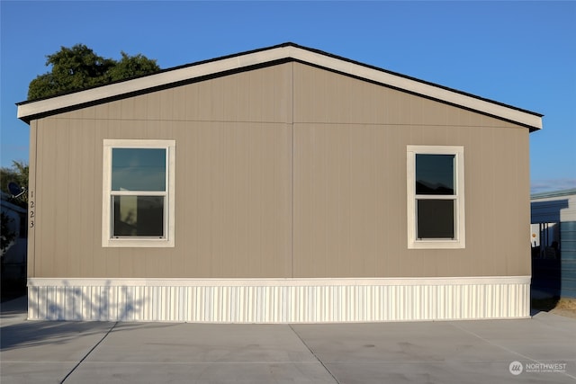 view of property exterior featuring a patio area