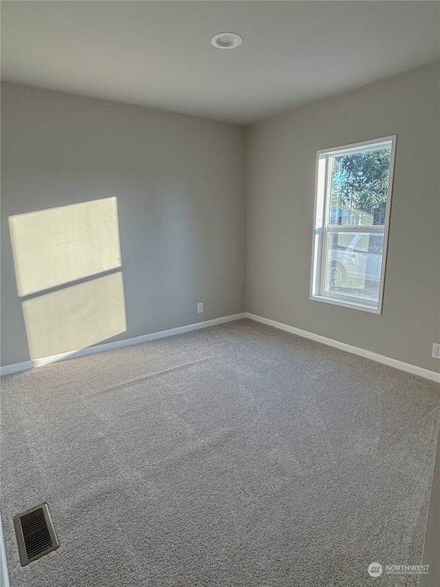 view of carpeted spare room