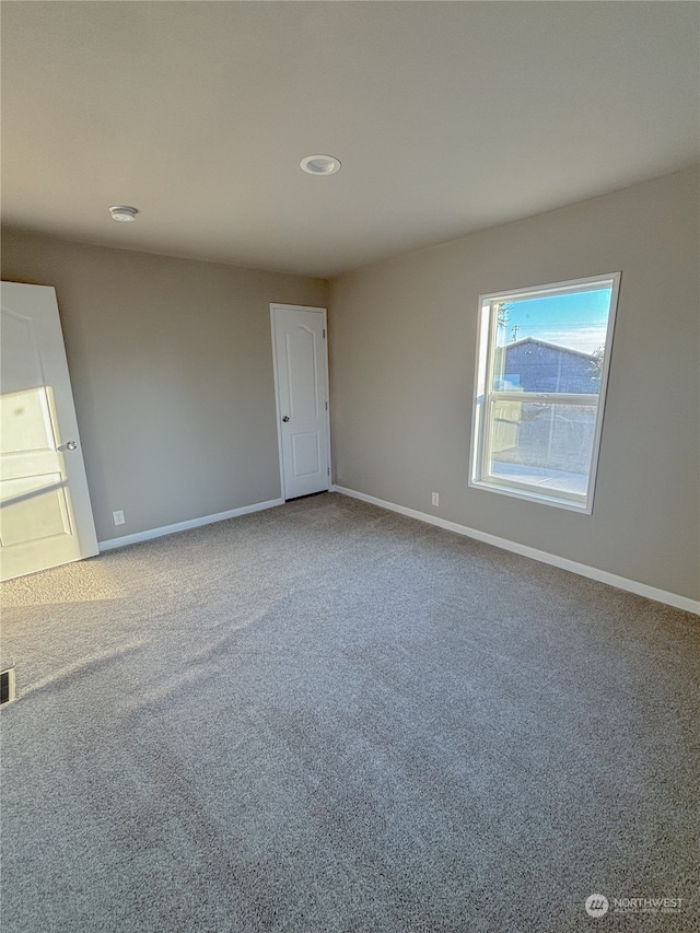 spare room with carpet floors