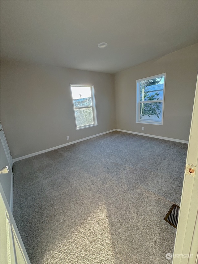 empty room with carpet flooring