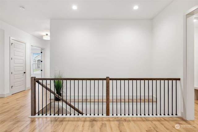 hall with light hardwood / wood-style floors