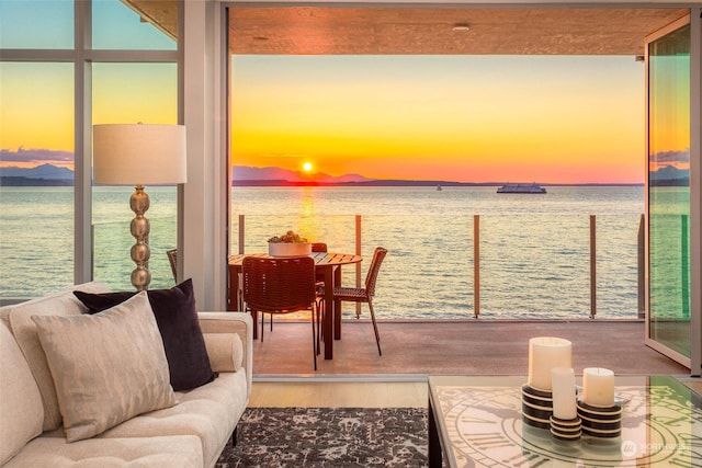 view of dock with a water view and a balcony