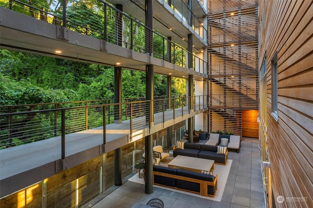 exterior space featuring outdoor lounge area and a balcony