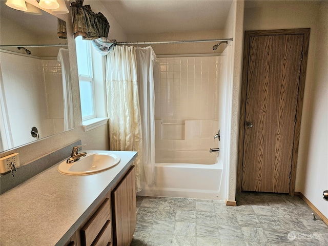 bathroom with shower / tub combo with curtain and vanity