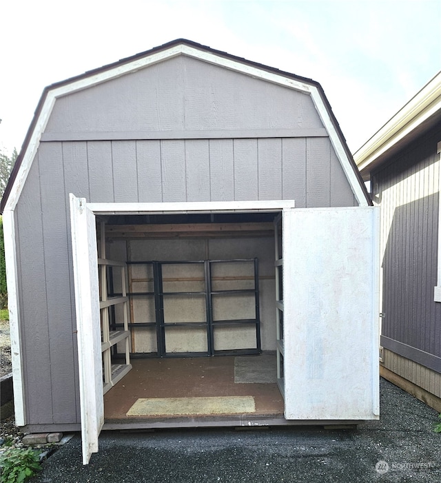 view of storm shelter with a shed