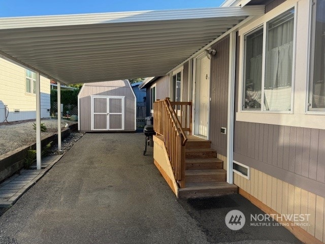 view of patio / terrace with a storage shed