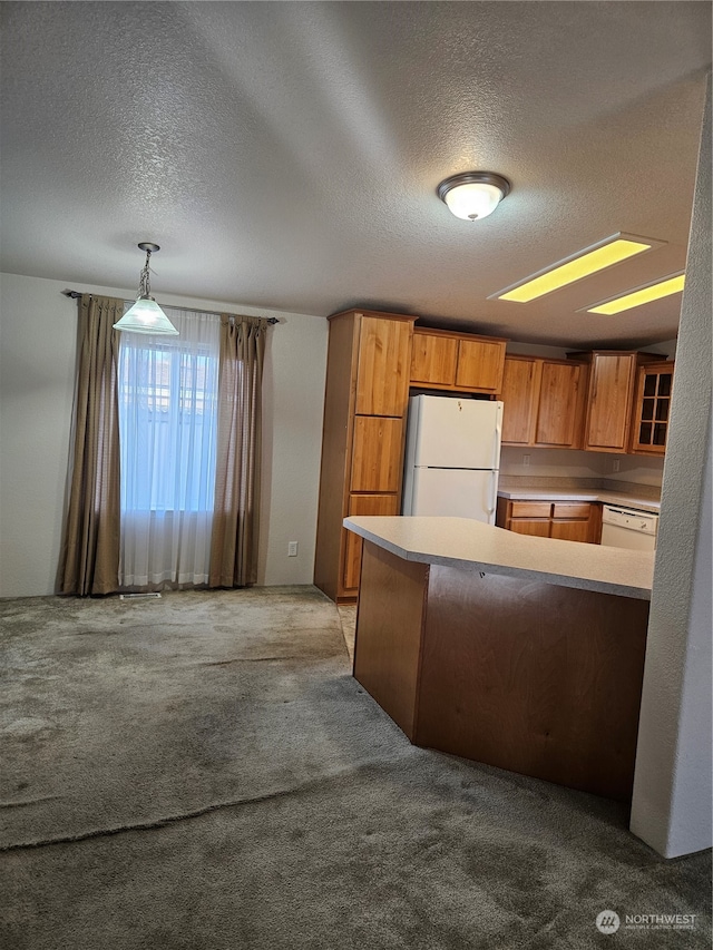 kitchen with white appliances, light carpet, decorative light fixtures, and a textured ceiling