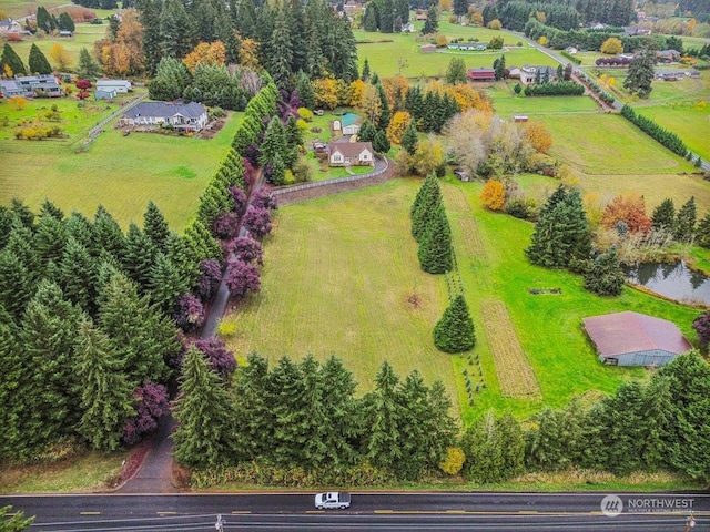 aerial view featuring a rural view and a water view